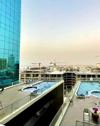 Fully furnished apartment for rent in Ajman (Al Waha Tower), directly overlooking the sea. It features a fully equipped kitchen and a balcony; the price is 27,000 AED.