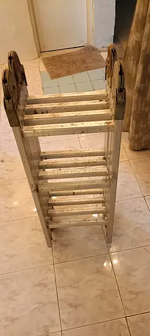 Folding multi-position aluminum ladder - sturdy, used. Can be folded very easily and stored. Sharjah