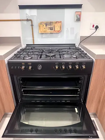 Black freestanding gas oven and 5-burner stove - good condition
