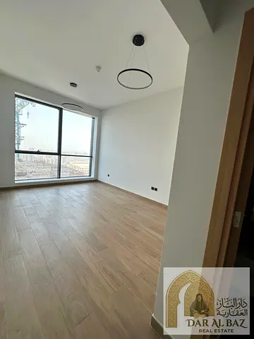 Luxurious two-bedroom apartment with a living room for annual rent in Al Mamzar, featuring three ba