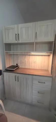 Light wood with built-in shelves and drawers