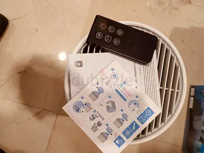 Compact round air purifier with remote control - good condition