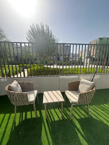 Outdoor patio set 4 woven chairs with side table on artificial grass