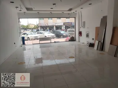Spacious commercial shop available for annual rent in Al Rawda 3, Ajman, featuring a prime location on a busy main road that offers excellent visibili