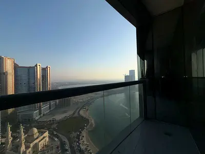 Spacious 2BR + Hall in Al Taawun: Partial Sea View, Gym, Pool & Dedicated Parking