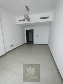 Two bedrooms and a living room, including parking, a gym, and free pool access, in the Umm Al-Tarfa
