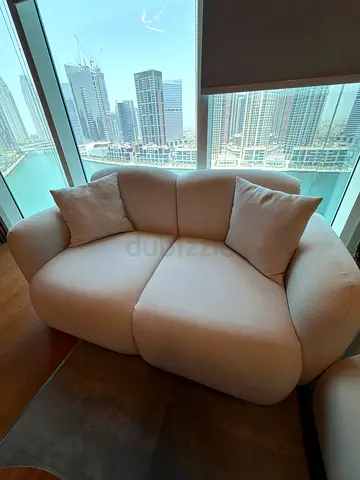 Light beige 2-seater compact sofa in excellent condition 2 pieces + table