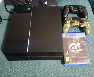 Sony PlayStation 4 with 2 original controllers and Gran Turismo game