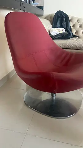Red modern swivel lounge chair with metal base