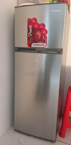 Silver double-door Olsenmark refrigerator - good condition