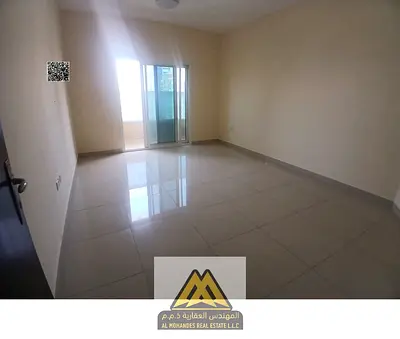 Annual rent: 1-bedroom apartment in Al Nuaimiya 1, 2 bathrooms, separate living room, balcony, buil