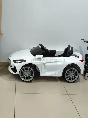White Electric Ride-On Car for Kids - Mercedes-Style, Good Condition-Peddle as well as remote contro