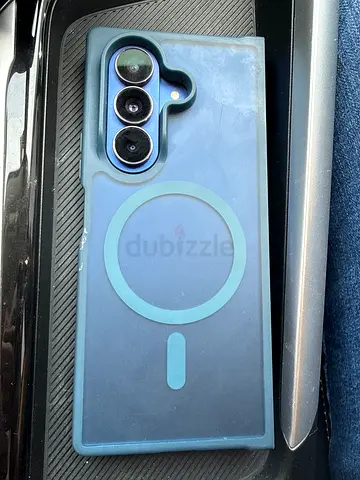 Phone with circular triple camera — used, good condition