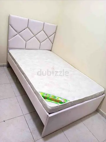 Single white upholstered bed with mattress - good condition