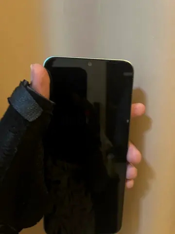 Used Honor smartphone with screen protector - good condition