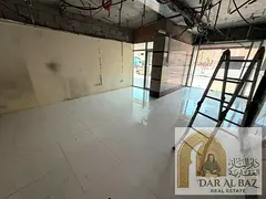 Shop for annual rent in Al Nahda, Sharjah, opposite Sahara Mall, on a main road. Large shop area.