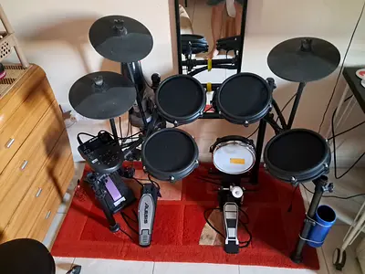 Alesis Nitro Mesh drum kit with Millenium Kick tower