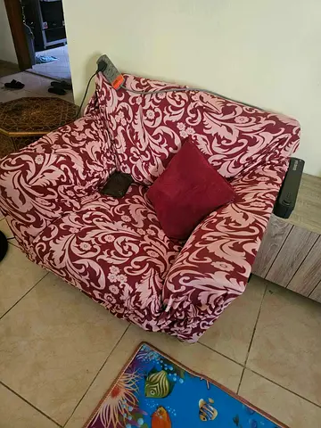 Two-seater sofa armchair with patterned slipcover - good condition