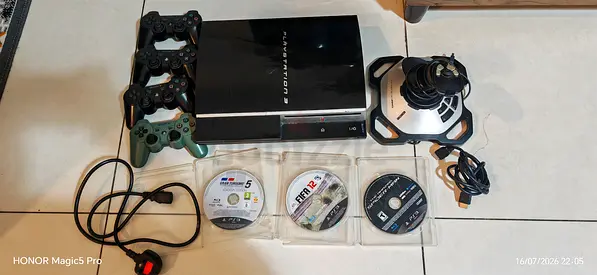 Ps3 (fat) with 3 games and 4 controllers and flight controller (price negotiable)
