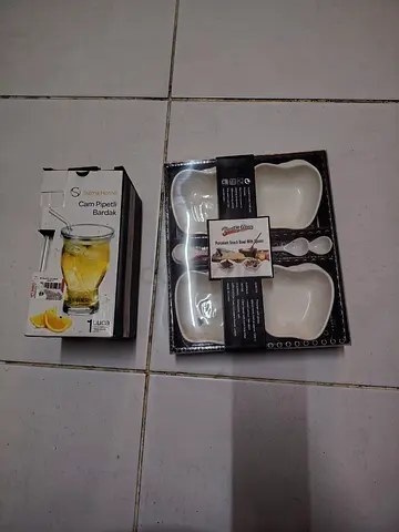 Set of new glass serving bowls and a glass pipette cup - unused