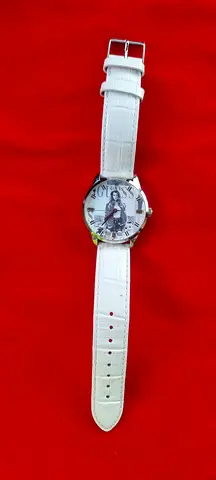White leather strap analog womens wristwatch with Eiffel Tower dial