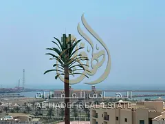 The most luxurious and most spacious two-Bhk in Al Qulaya, featuring a balcony with a sea view, a pr
