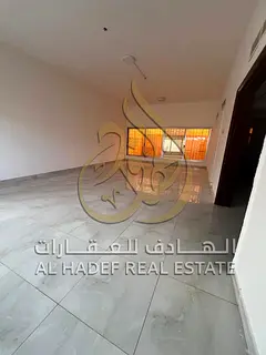 A villa in the Al Ghafia area featuring 3 bedrooms, a courtyard, a garden, a majlis, a spacious livi