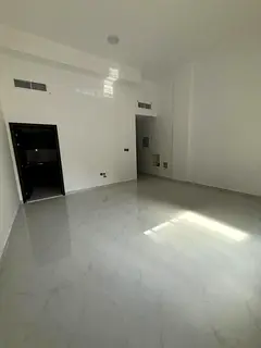 For annual rent, a new studio, first tenant, with separate kitchen in Al Karama area - Ajman
