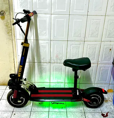 Electric scooter with seat — used, working, green LED lights