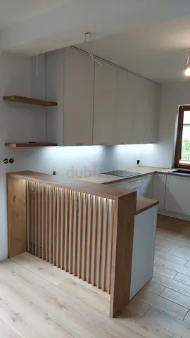 Modern shape kitchen island with extended top and cabinets storage