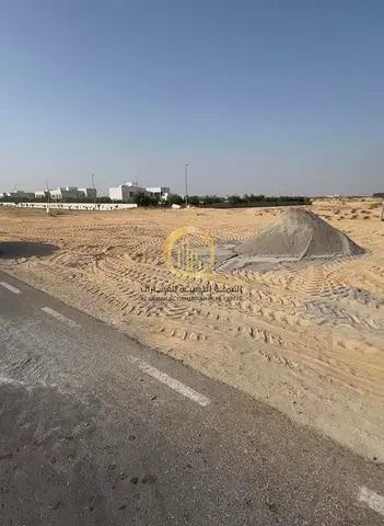 For sale: residential land in Al-Houshi area, Al-Baidya suburb, Sharjah Emirate. Area: 5000 sq ft on two streets, front and back.