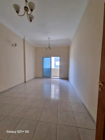 Annual apartment for rent in Al Qasimia Al Mahatta. One bedroom, living room, bathroom, balcony, central AC, prime location opposite the park and near