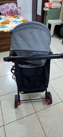Lightweight grey baby stroller - compact and foldable