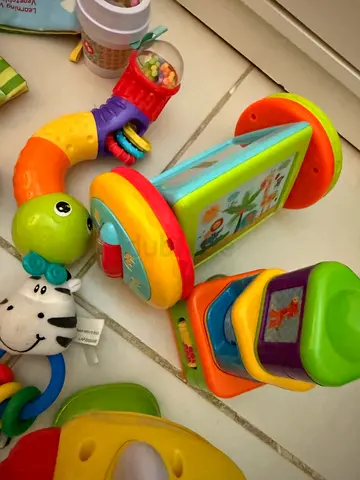 Lot of mixed baby rattles and activity toys - good condition