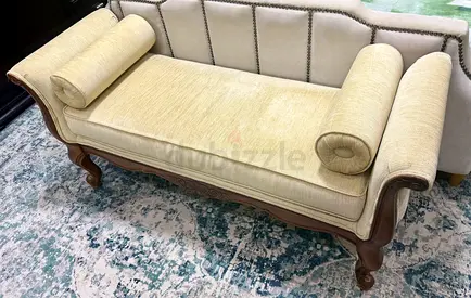 Vintage wooden chaise lounge / bench with bolsters - cream upholstery