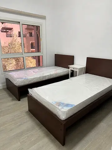 Two single wooden beds with mattresses - perfect condition