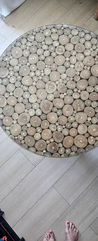 Round coffee table with embedded wood-slice top - neutral tones