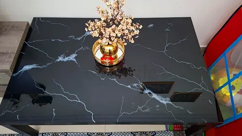 Black marble-effect coffee table in good condition