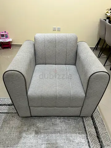 Modern Gray Upholstered Armchair with Piped Edges