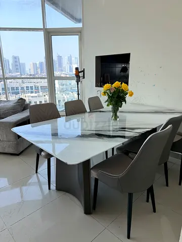 Marble Dining Table with 8 Modern Grey Chairs - Good Condition
