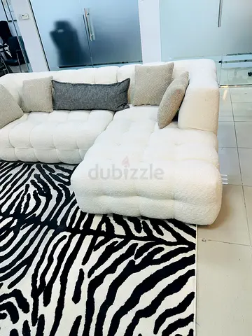 White tufted L-shaped boucle sofa - modern corner sectional