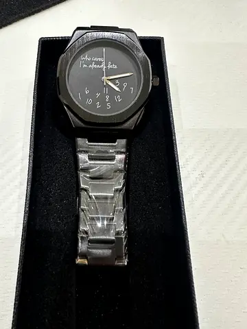 Mens analog stainless steel watch with black face — unused, in box
