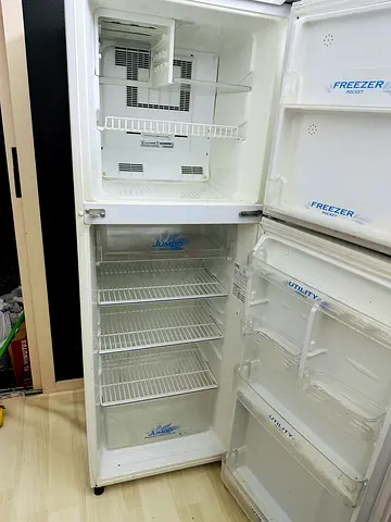 Used double-door refrigerator with freezer - working condition