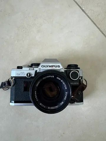 Vintage Olympus OM-10 35mm film camera with original Olympus OM-System Zuiko MC Auto-S 50 mm f/1.8