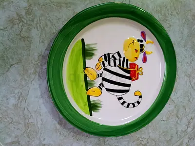 Hand-painted ceramic plate with zebra/animal design