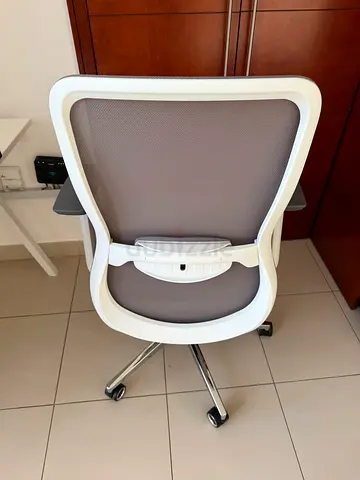White ergonomic mesh office chair with chrome base