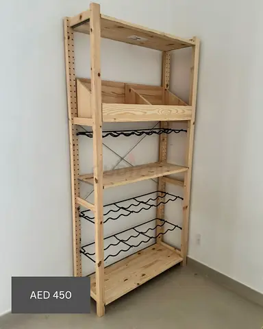 IKEA pine shelving unit with wine racks and storage bins - light wood