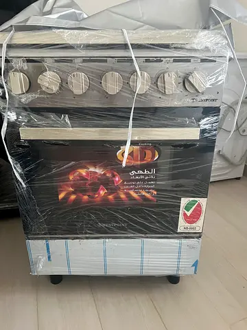 Brand new gas oven with stove top - still wrapped
