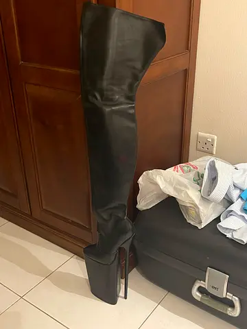 Pair of black leather over-the-knee high-heel boots, size 37.5 EU