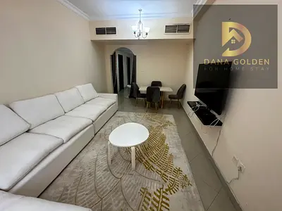 Two bedrooms, a living room, two bathrooms, and a balcony for monthly rent in Sharjah, Al Taawun area.